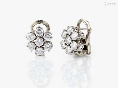 A pair of entourage-set stud earrings decorated with brillia...