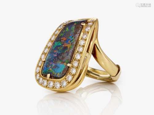 A ring with a boulder opal and brilliant-cut diamonds