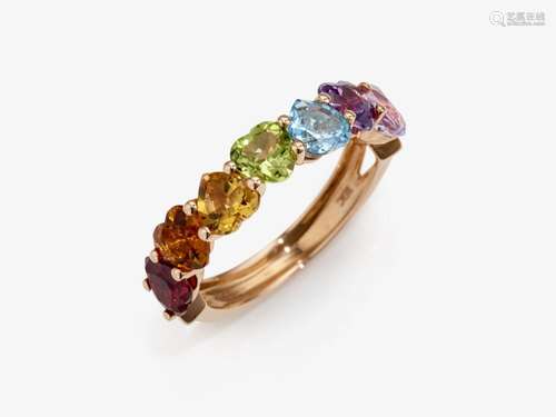 An eternity ring with multi-coloured and heart-shaped gemsto...