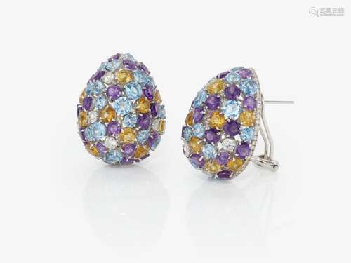 A pair of stud earrings decorated with brilliant cut diamond...