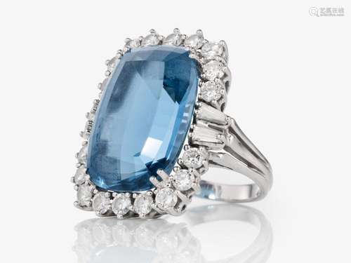 A topaz and diamond ring