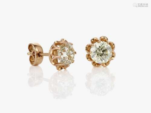 A pair of stud earrings decorated with fancy light yellow br...