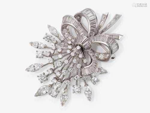 A brooch in the shape of a stylized bouquet of flowers set w...