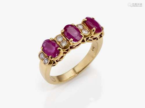 An eternity ring decorated with rubies and brilliant-cut dia...