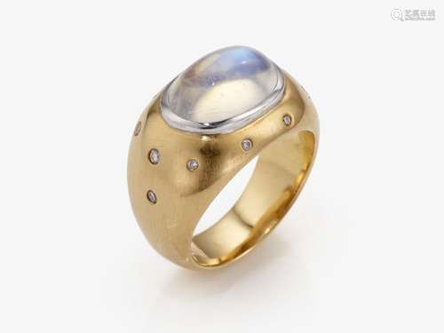 A classic jacket ring decorated with a moonstone and brillia...