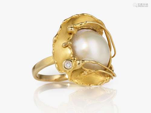 A fancy cocktail ring decorated with a fine Mabé cultured pe...