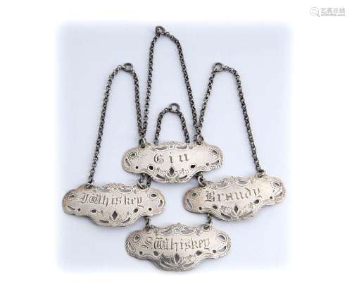 Set of four English Victorian sterling silver wine labels - ...