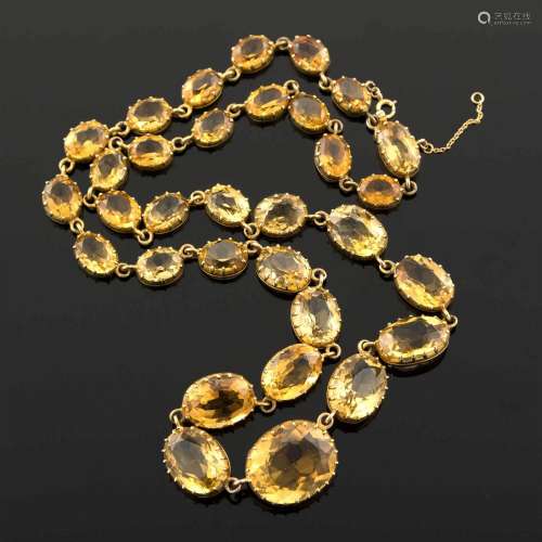 A fourteen karat gold and citrine necklace