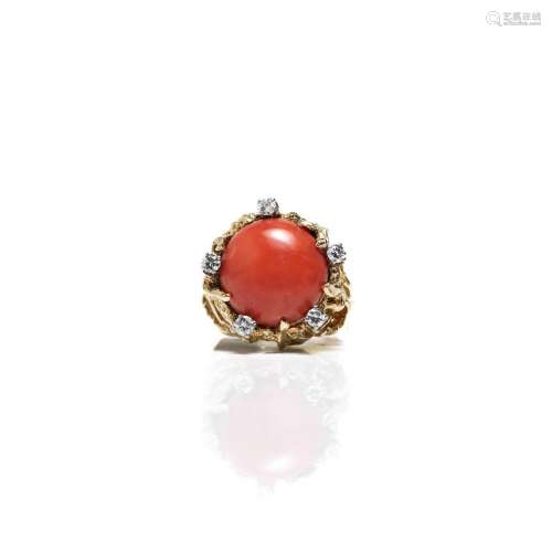 A fourteen karat gold coral and diamond ring