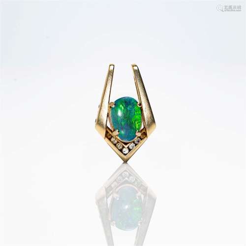 A fourteen karat gold diamond and opal pendant