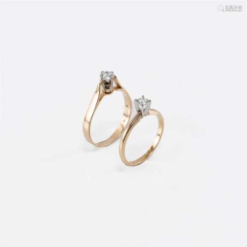 Two fourteen karat gold and diamond solitaires