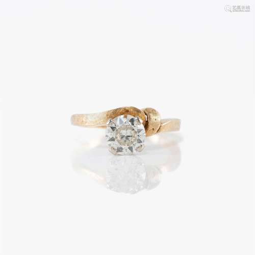 A fourteen karat white and yellow gold and diamond solitaire
