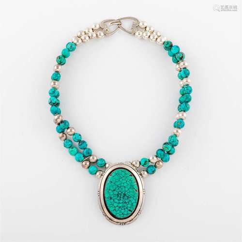 A Native American-style turquoise and sterling silver neckla...