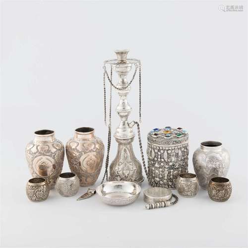 A collection of eleven Persian and Egyptian sterling silver ...