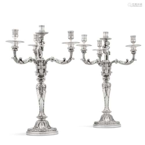 Royal: a pair of French silver four-light candelabra made fo...