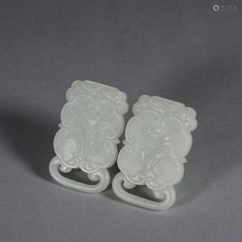 A pair of orchid patterned jade earrings