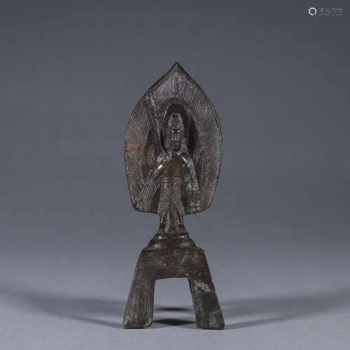 A copper buddha statuette with pedestal