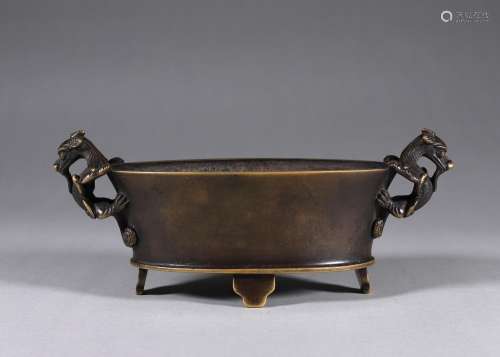 A three-legged copper censer with chi dragon shaped ears