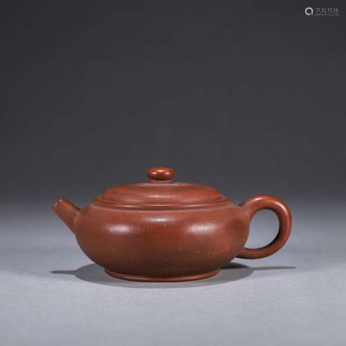A round Yixing clay teapot
