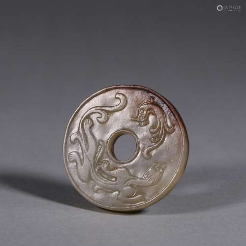A chi dragon patterned jade pendant