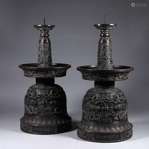 A pair of copper candlesticks
