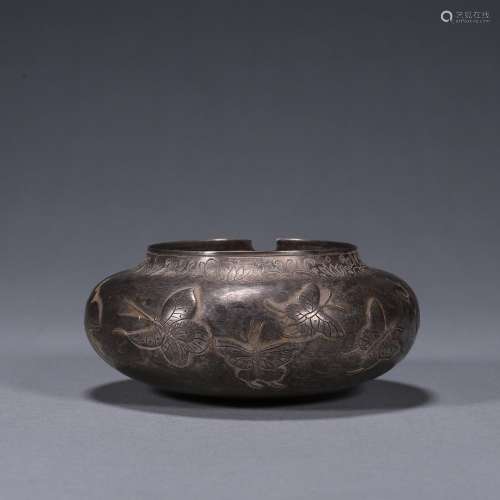 A butterfly patterned silver water pot