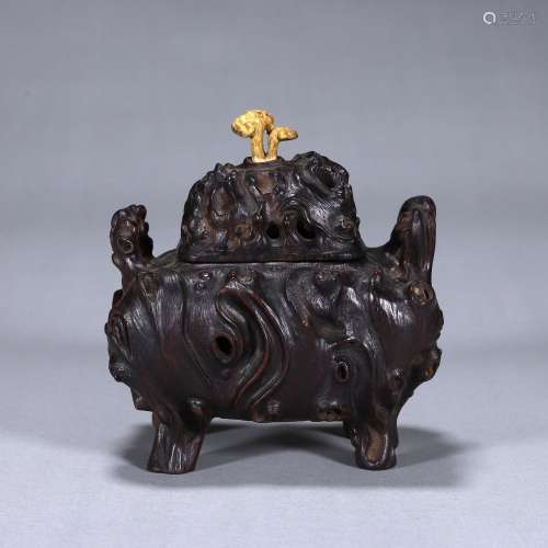 A double-eared wood incense burner