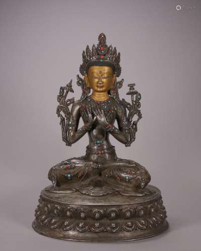 A silver Manjusri bodhisattva statue