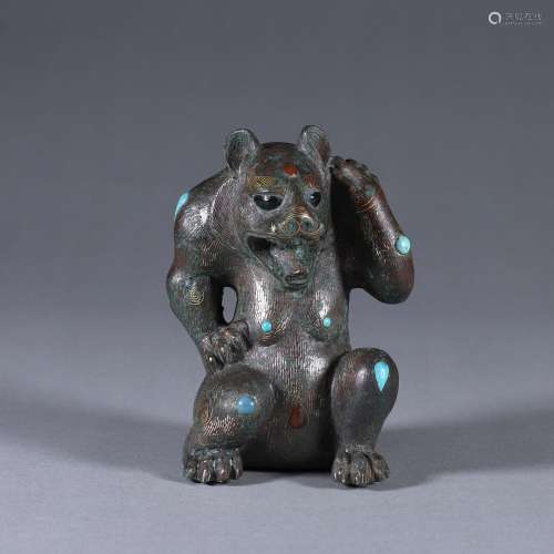 A gold and gem-inlaid silver bear ornament