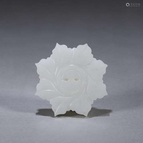 A flower shaped jade pendant