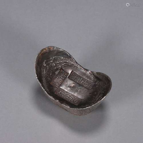 An inscribed silver ingot