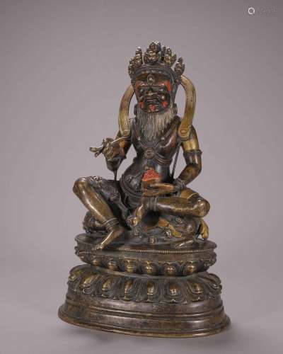 A silver-inlaid copper Mahakala statue