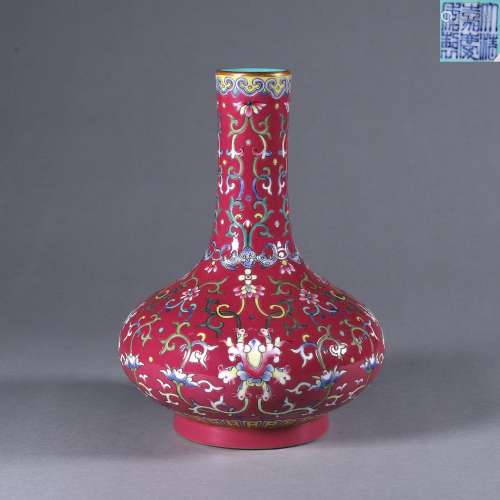 A red ground famille rose interlocking lotus porcelain vase