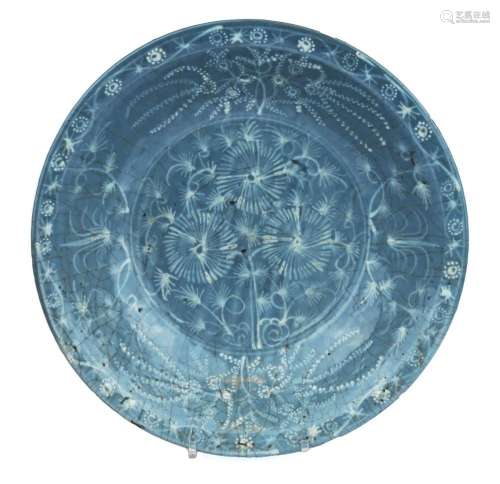 A large blue glaze Swatow dish with slip decoration