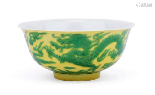 A yellow and green dragon bowl with incised decoration