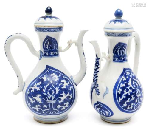 A pair of blue and white wine ewers