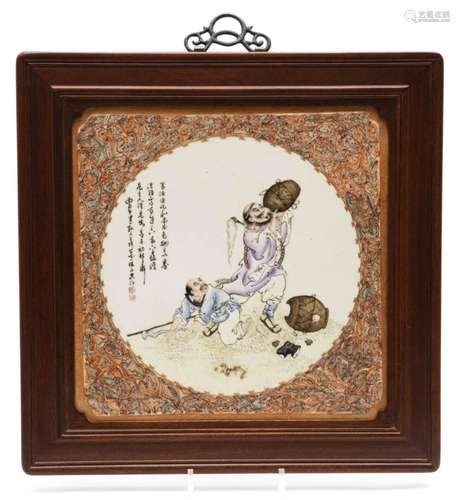 A porcelain plaque in wooden frame