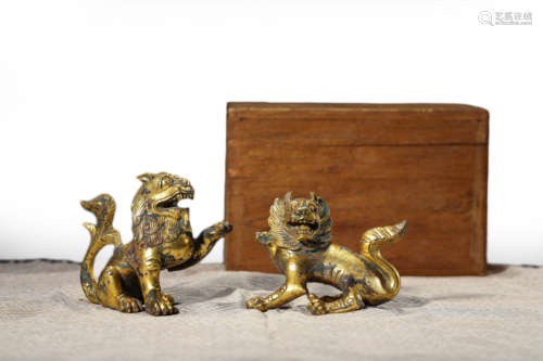 A pair of gilt bronze lions 