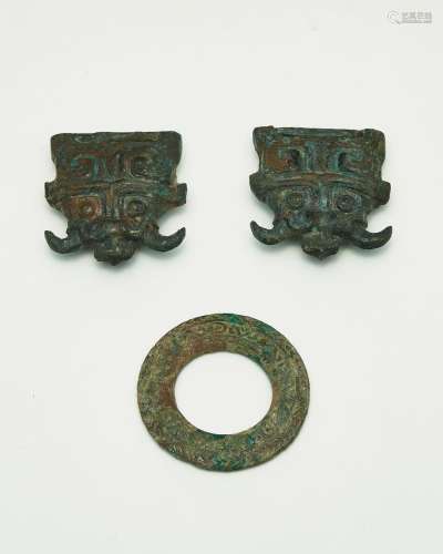 A pair of bronze harness fittings and a ring Spring and Autu...