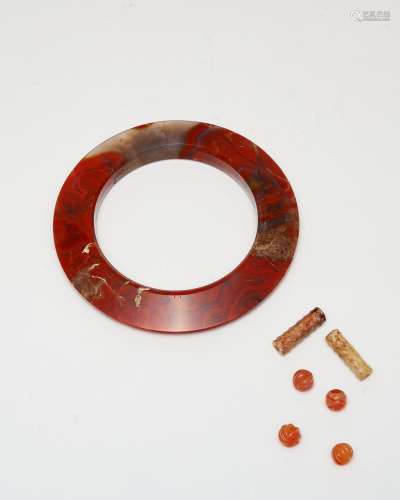 An agate ring, four agate beads and two stone tubes The agat...