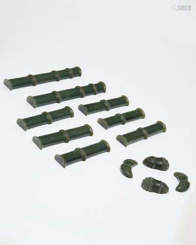 A suite of spinach jade 'bamboo' carvings 20th centu...