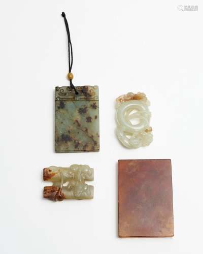 Two celadon jade carvings and two uncarved plaques 19th/ 20t...