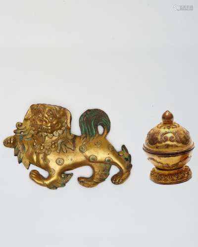 A gilt-bronze 'snow lion' plaque, and an incense hol...