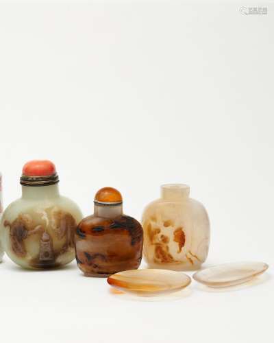 A celadon jade and two agate snuff bottles, and two agate sn...
