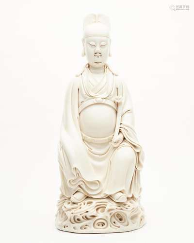 A dehua white-glazed figure of Wenchang He Chaozong impresse...