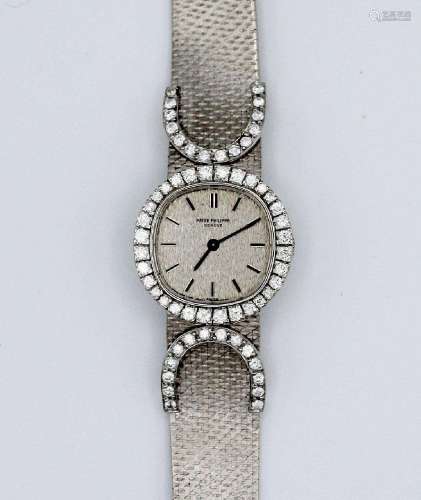 A lady's Patek Philippe 18kt white gold and diamond wristwat...