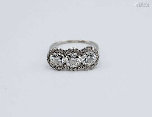 A lady's diamond trinity ring in 18kt white gold