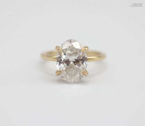 A lady's diamond engagement ring set in 14kt yellow gold