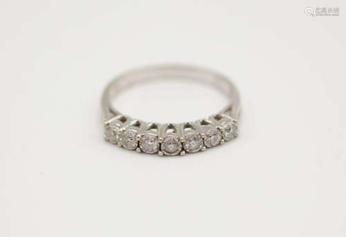 A lady's diamond wedding band in 14kt white gold