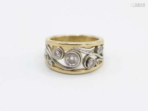 A lady’s 18kt yellow and white gold diamond pierced band